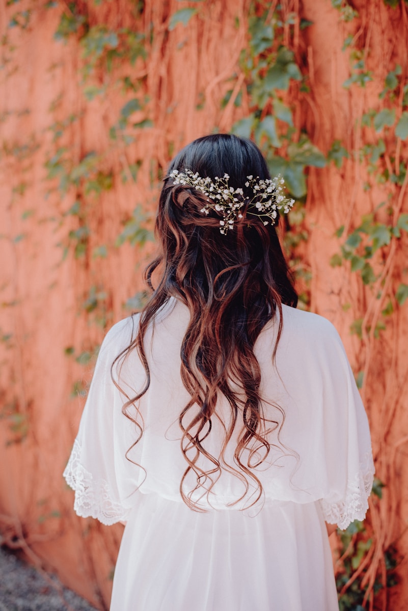 a woman with long hair wearing a flower crown